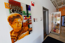 Marilyn K. Glick glass portrait on the wall inside the center.