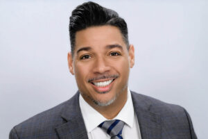 Dr. Jason Rivera smiling in a professional headshot.