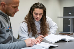 A student and tutor discuss school work