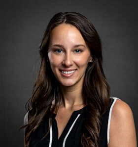 headshot of a brunette caucasian woman smiling