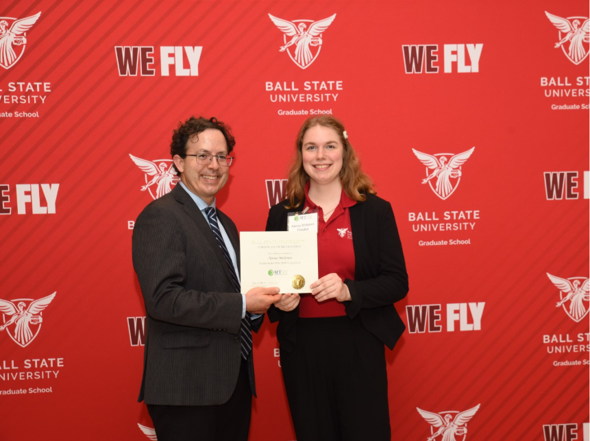 Image of Alena holding her certificate.