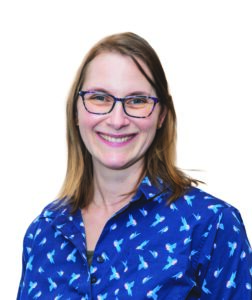 headshot of a woman wearing glasses