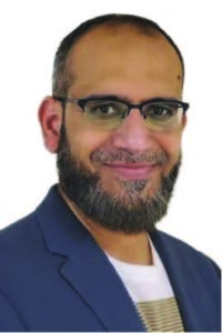 headshot of a man with glasses