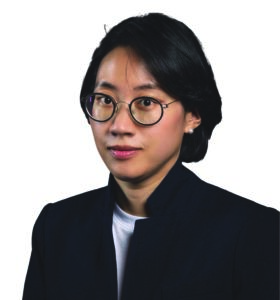 headshot of a woman with glasses