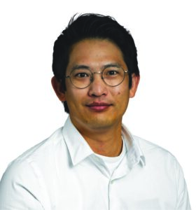 headshot of a man with glasses