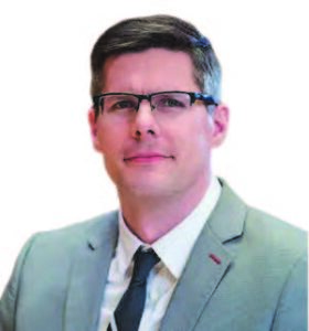 headshot of a man with glasses