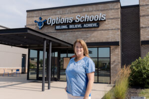 Woman standing in front of Options Schools charter school