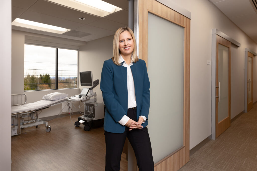 Woman CEO standing in front of a hospital room