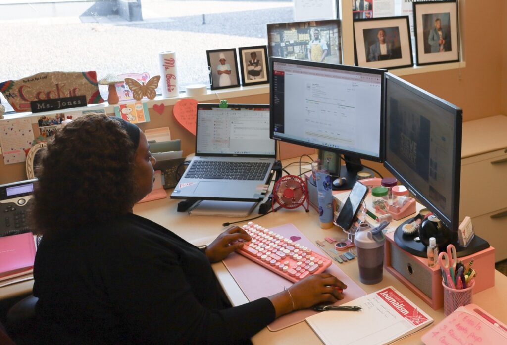 SJSC Advisor Eldred Coleman-Jones works on her computer at her desk.