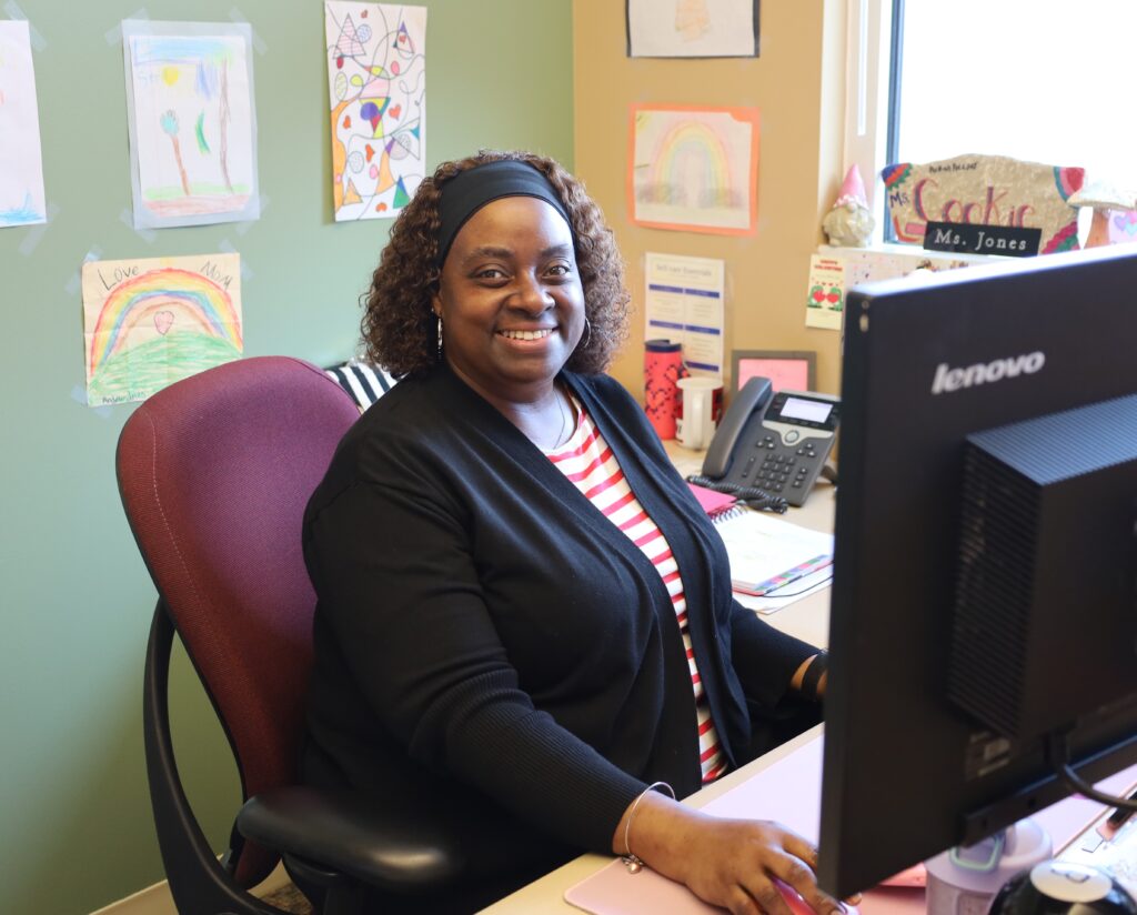 SJSC Advisor Eldred Coleman-Jones sits at her desk in her office.