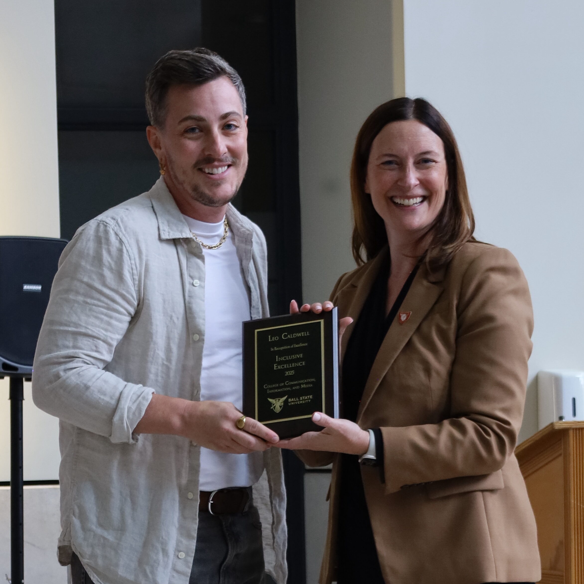 CCIM Dean Kristen McCauliff awards Leo Caldwell with the Inclusive Leadership Award.