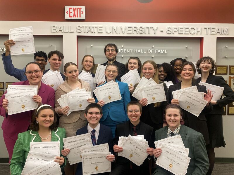 Ball State Speech Team poses with their awards from the annual Indiana Forensic Association (IFA) tournament.