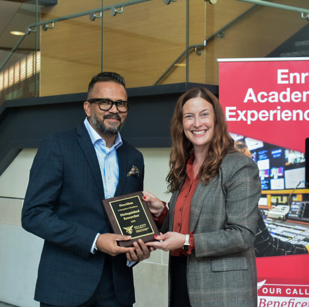 Dean McCauliff poses with Firoz Khan for the CCIM Distinguished Researcher award at the 2026 CCIM Faculty Awards Ceremony.