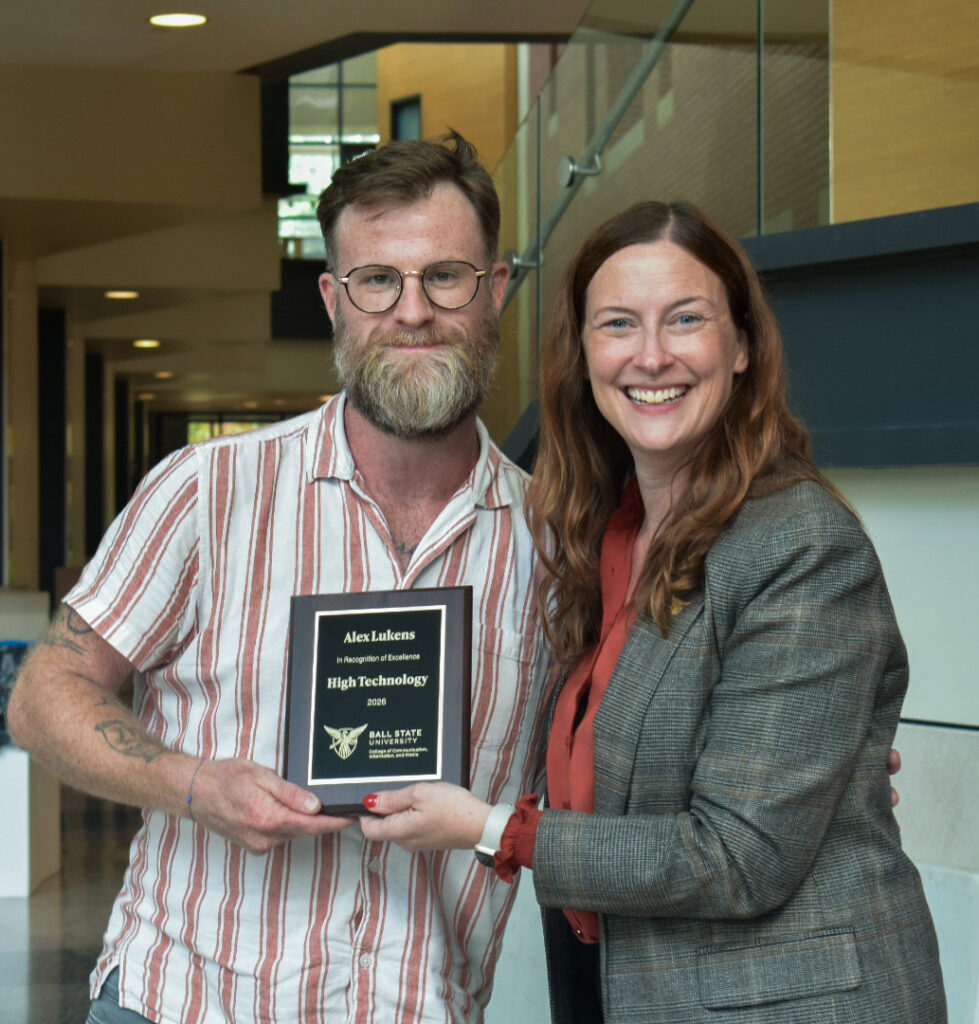 Dean McCauliff poses with Alex Lukens for the CCIM High Technology award at the 2026 CCIM Faculty Awards Ceremony.