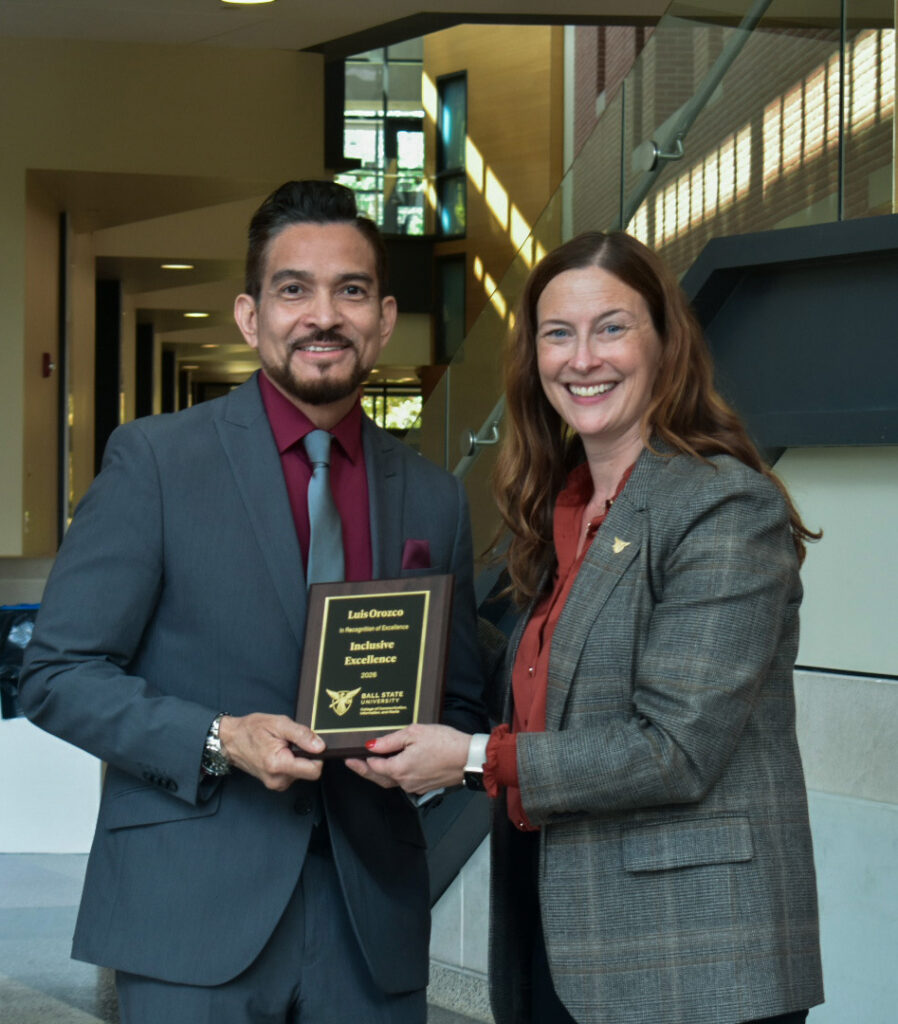 Dean McCauliff poses with Luis Orozco for the CCIM Inclusive Excellence award at the 2026 CCIM Faculty Awards Ceremony.