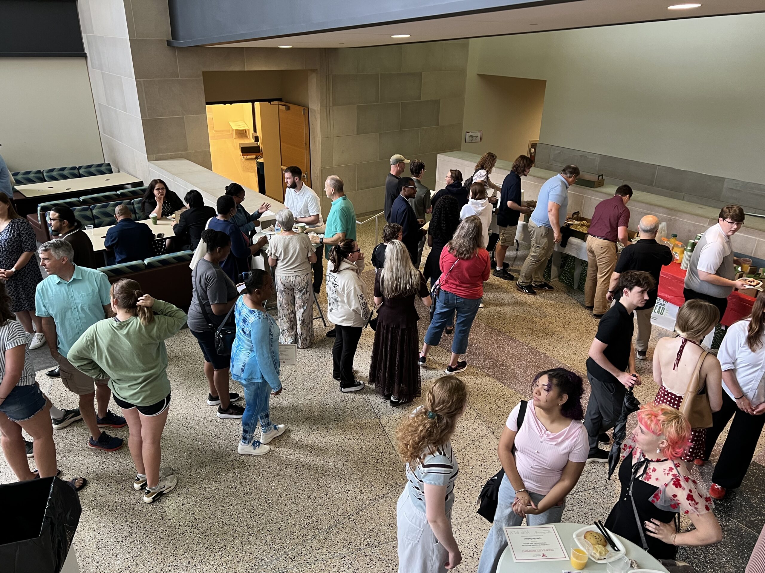 Attendees of the 2026 CCIM Dean's List Open House mingle in the Letterman Lobby.