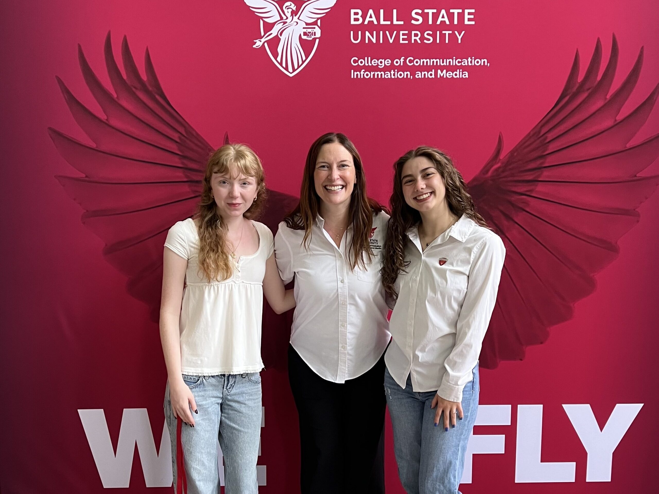 Dean Kristen McCauliff poses for a photo at the Dean's Open House with students Izzy Adams and Amelia Harker.