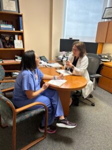 Dr. Brock in her office with her APP colleague Morgan Bruno.