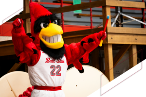 The mascot of Charlie Cardinal celebrating One Ball State Day.