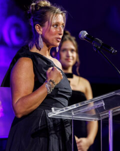 Carrie Lively presenting at a conference. 