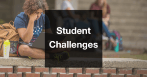 "Student Challenges" text superimposed over an image of a student looking intently at their laptop.