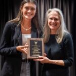 Student Gracee Gibson and Professor Rebecca Brey pose with the Accessible Teacher Award plaque