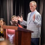 Larry Markle, former Director of Disability Services and current Director of the Fehribach Center speaks at the podium to present the Fehribach and Markle Awards