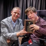 Student Dillon Rosenlieb and Larry Markle (former Director of Disability Services and current Director of the Fehribach Center) pose together with the Markle Award