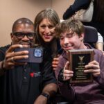 Student Dillon Rosenlieb poses with his award and two Media faculty who attended the Award Ceremony to support him