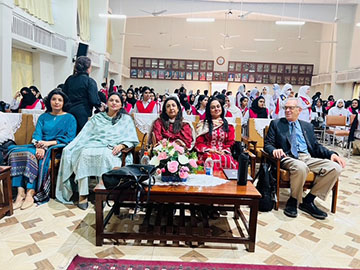 Dr. Larry Gerstein, on the far right of the photo, poses with female Pakistani students at one of his lectures for the Post Graduate School for Girls. 