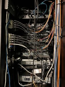The back of a mic tower with lots of wires