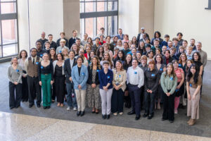 Digital Corps students and alumni pose for a group photo.