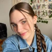 a woman with brown hair in a braid.