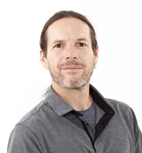 A man in a grey sweater