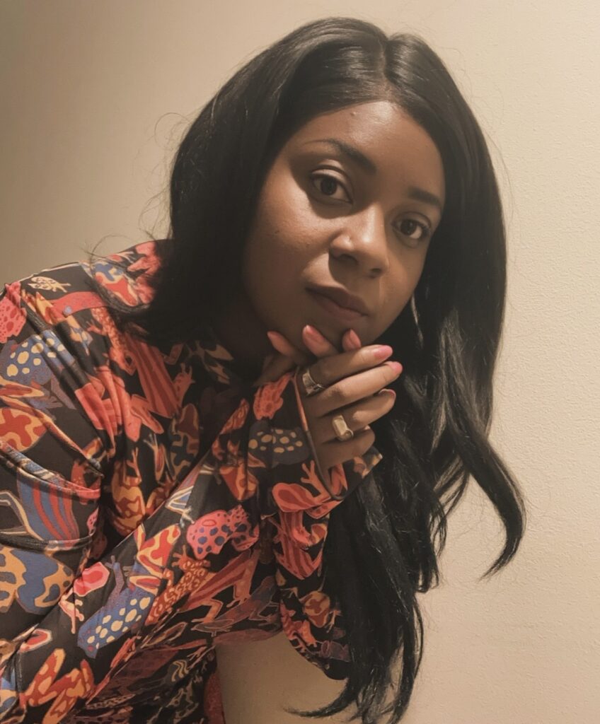 an African American woman in a flowered shirt