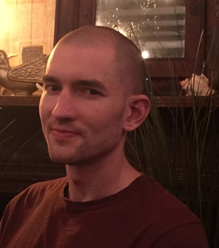 a man with shaved head